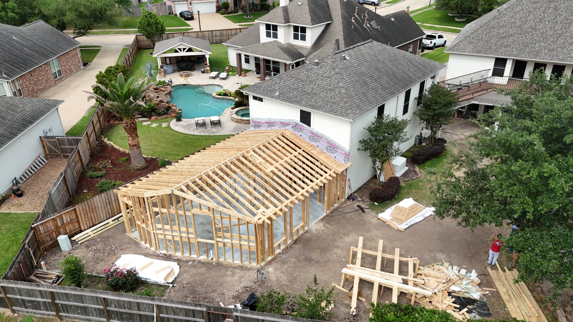 Aerial view of a backyard tiny home under construction in Houston