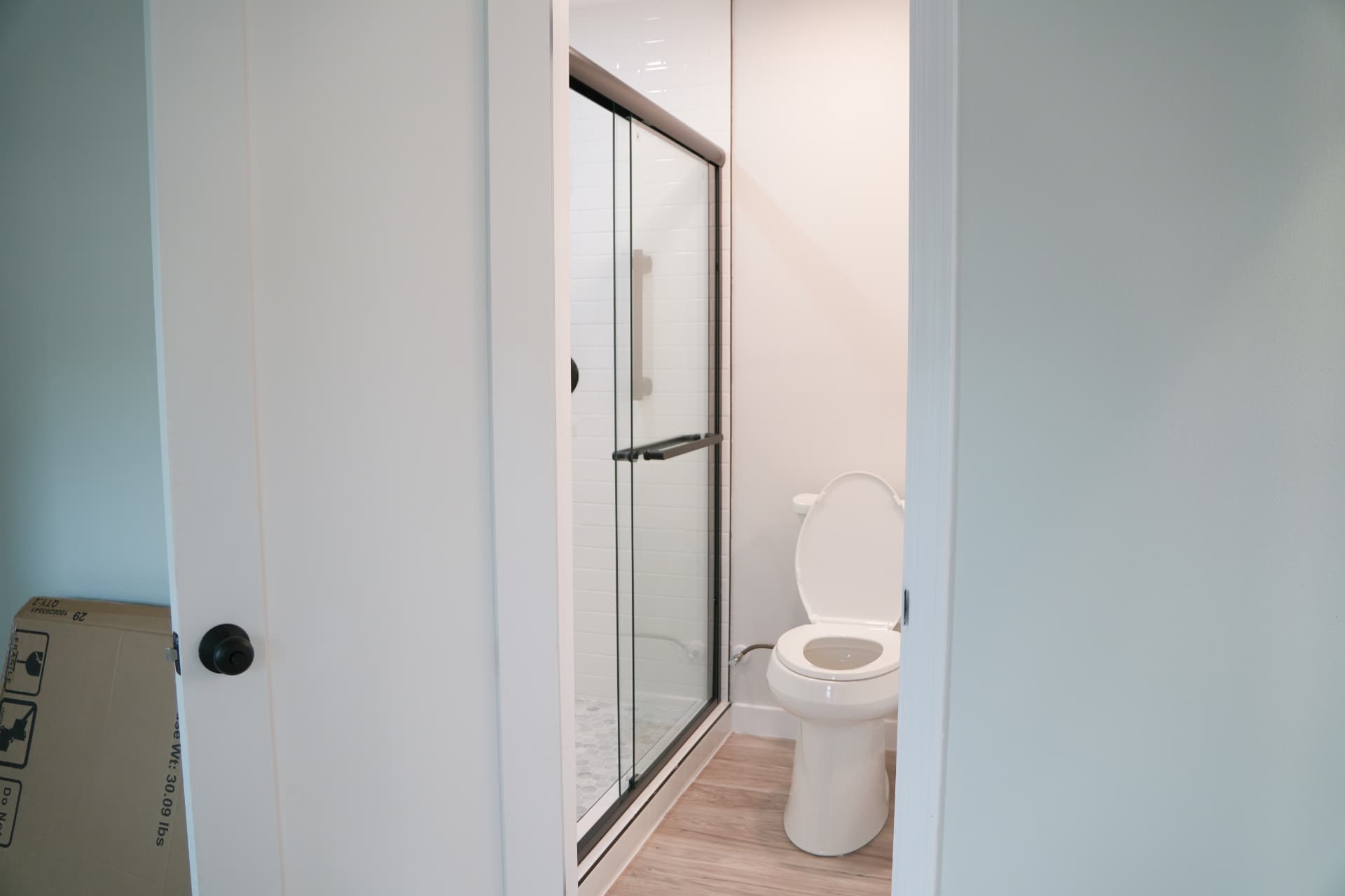 Finished bathroom with glass shower enclosure